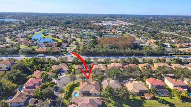 birds eye view of property featuring a water view