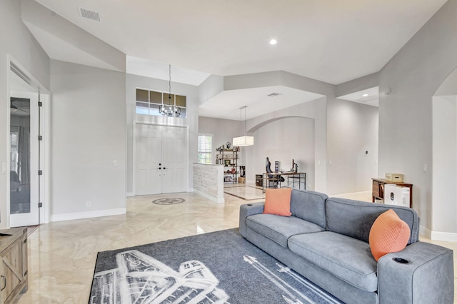 living room featuring an inviting chandelier