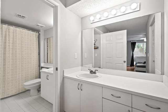 full bathroom with tile patterned flooring, visible vents, toilet, and vanity