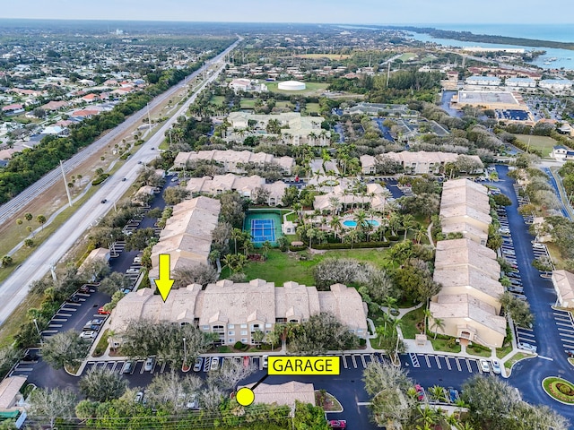 birds eye view of property with a water view