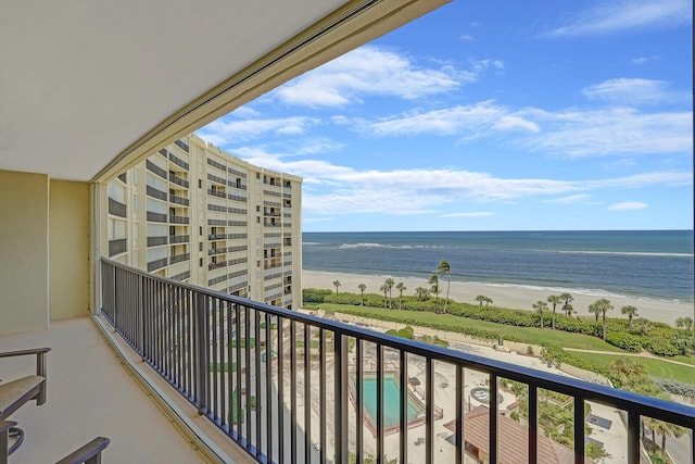 balcony with a view of the beach and a water view