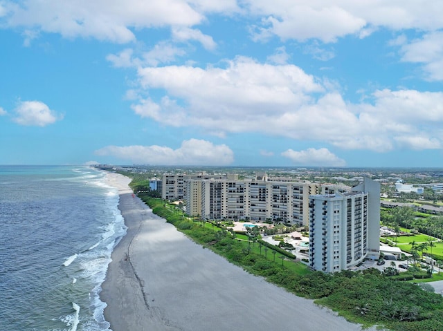 aerial view with a water view and a beach view