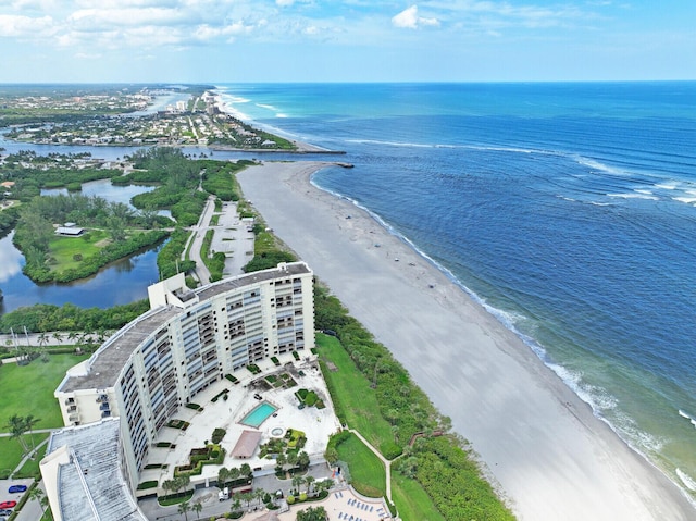 aerial view with a water view and a beach view