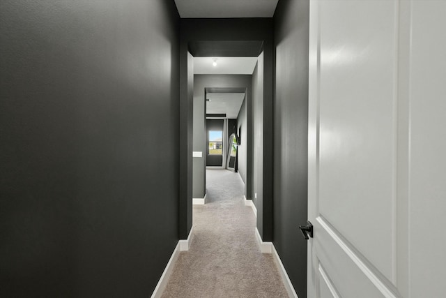 hallway with light colored carpet