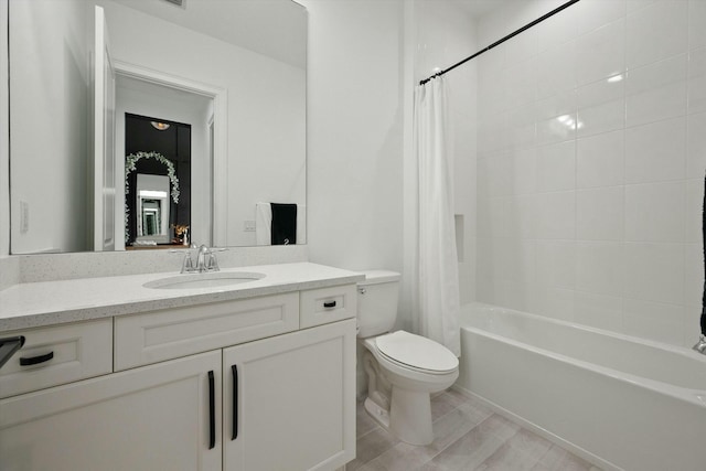 full bathroom featuring vanity, toilet, and shower / bathtub combination with curtain