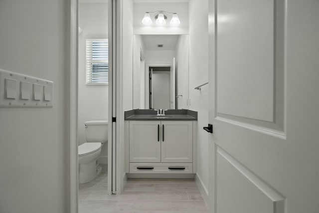 bathroom with vanity and toilet