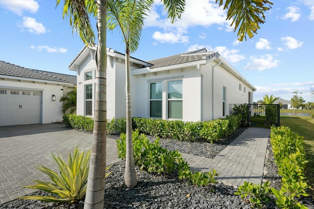 view of side of property with a garage