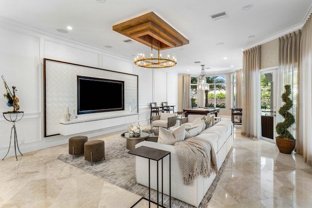 living room featuring a chandelier, ornamental molding, and pool table