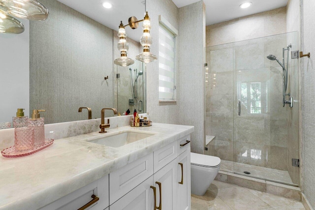 bathroom featuring an enclosed shower, vanity, toilet, and tile patterned flooring