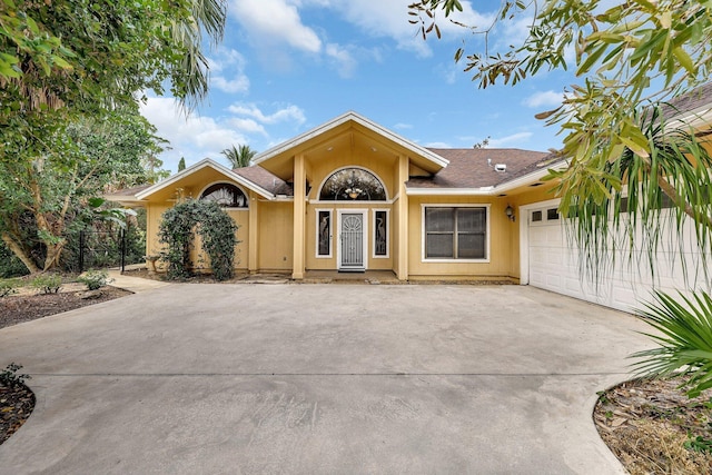 ranch-style home with a garage