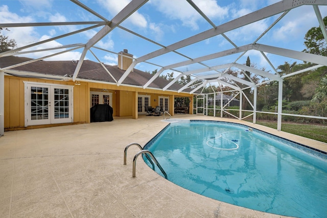 view of pool featuring a lanai, a patio area, french doors, and a grill