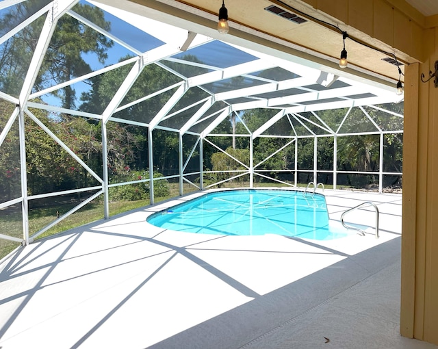 1643 SW Gregor Way, Stuart, FL 34997 - swimming pool featuring a lanai and a patio