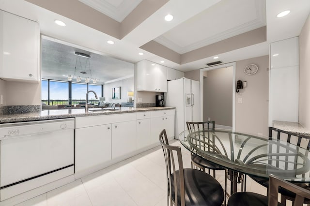 kitchen featuring white cabinetry, crown molding, white appliances, and sink