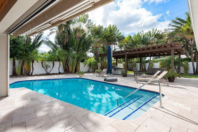 view of pool with a pergola and a patio area