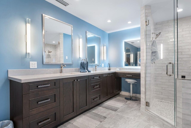 bathroom with walk in shower and vanity