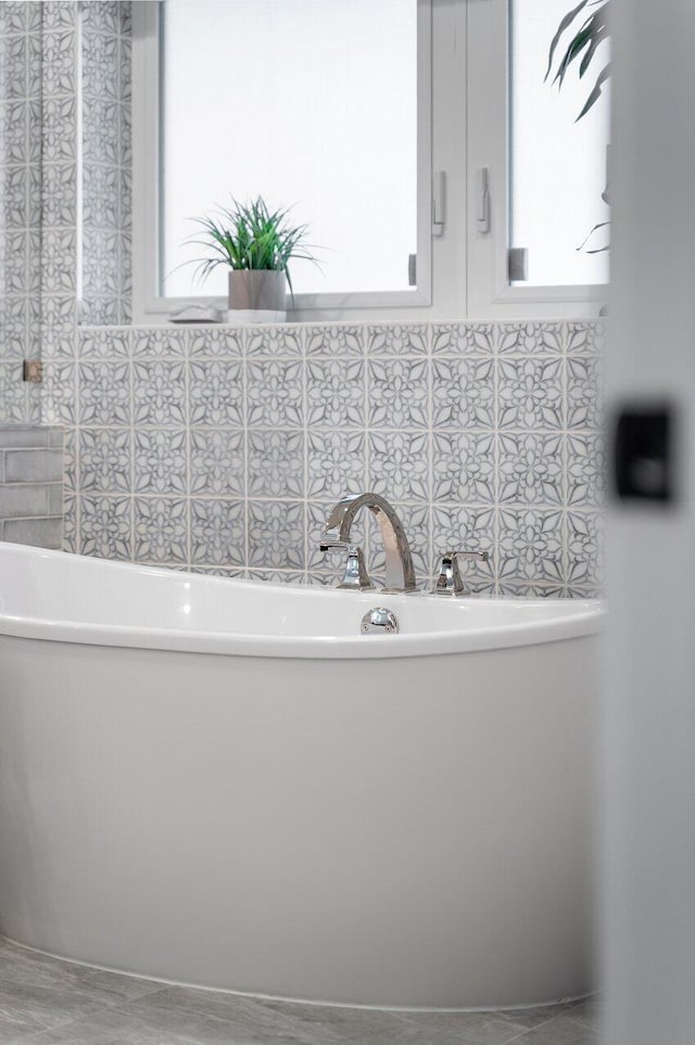 bathroom featuring a tub