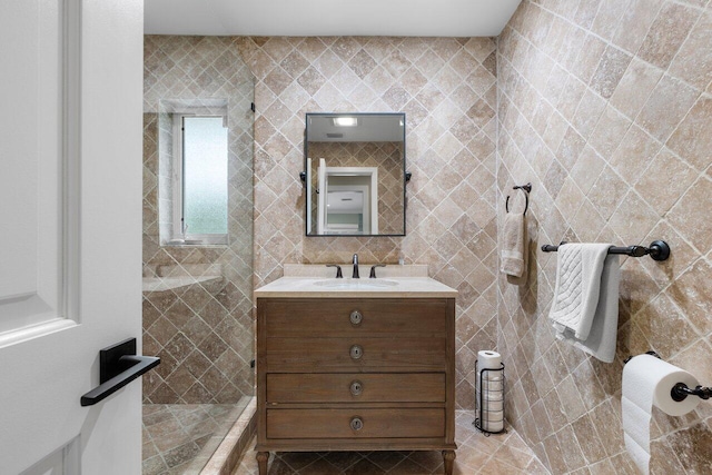 bathroom with tile walls and vanity