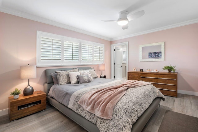 bedroom featuring ceiling fan, crown molding, and light wood-type flooring