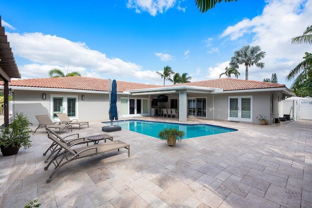 view of pool featuring a patio and ceiling fan