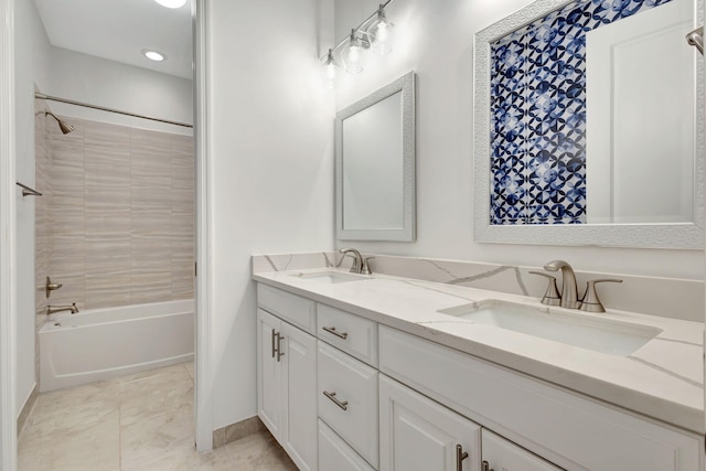 bathroom with vanity and tiled shower / bath