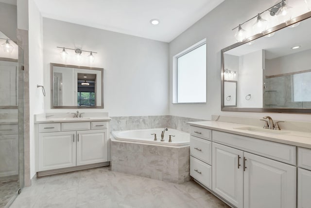 bathroom featuring plus walk in shower and vanity