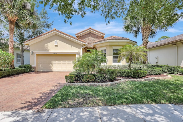 mediterranean / spanish-style house featuring a garage