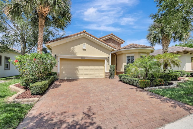 mediterranean / spanish-style home with a garage