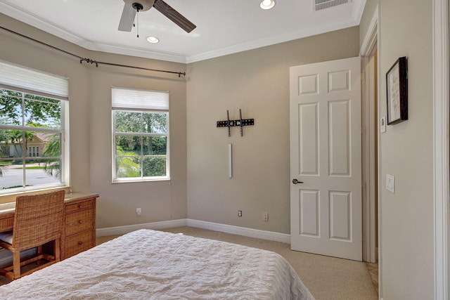 bedroom with ceiling fan, crown molding, and light colored carpet