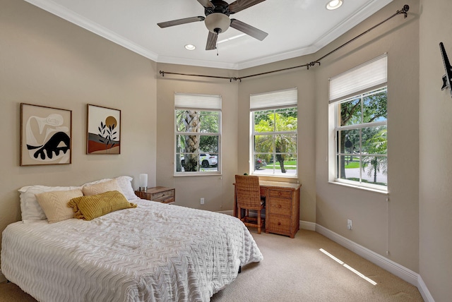 carpeted bedroom featuring ceiling fan and ornamental molding