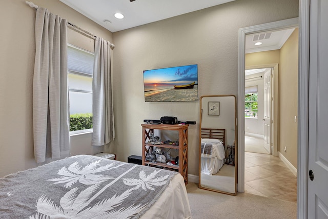 tiled bedroom with crown molding and multiple windows