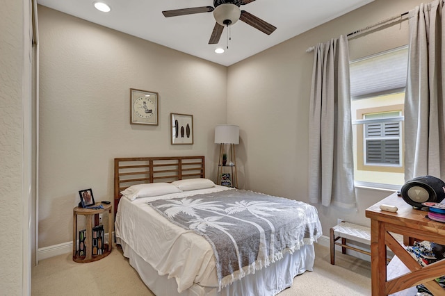 carpeted bedroom featuring ceiling fan