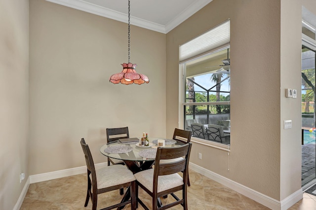 dining space with crown molding