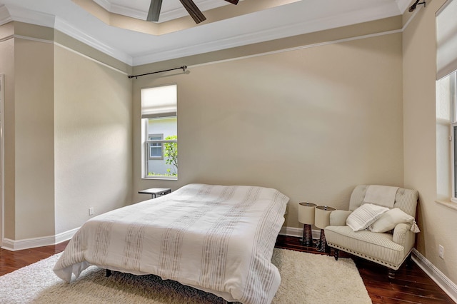 bedroom with ceiling fan, crown molding, and dark hardwood / wood-style floors