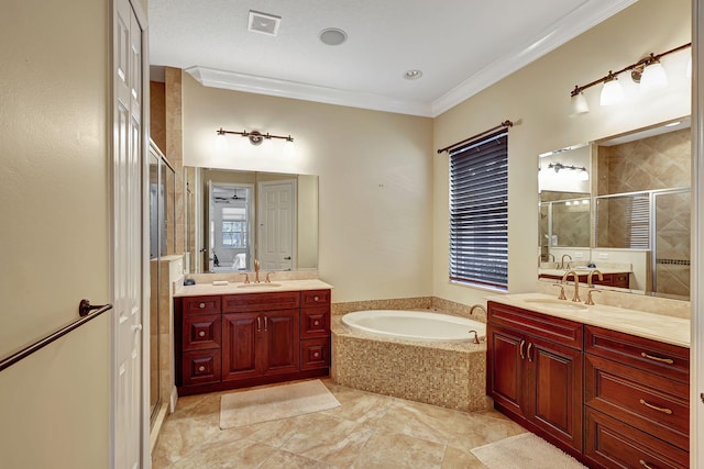 bathroom with vanity, independent shower and bath, and ornamental molding