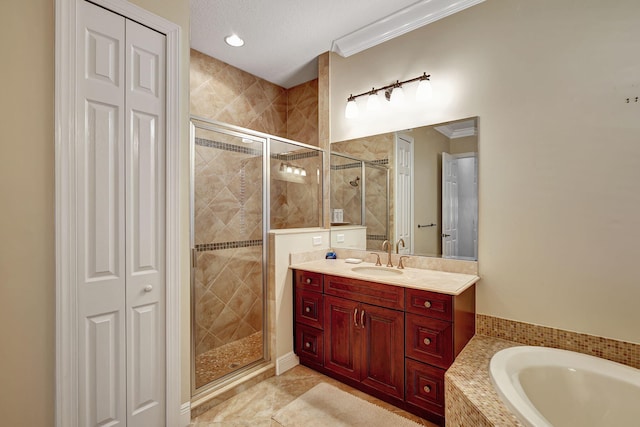 bathroom with tile patterned flooring, ornamental molding, vanity, and independent shower and bath