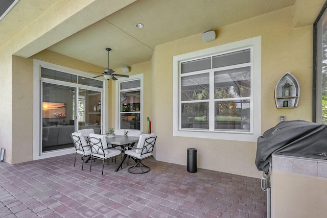 view of patio with ceiling fan and grilling area