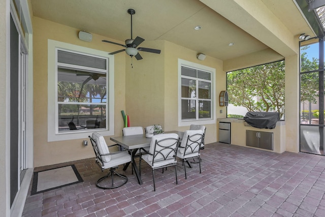 view of patio / terrace featuring area for grilling, grilling area, and ceiling fan