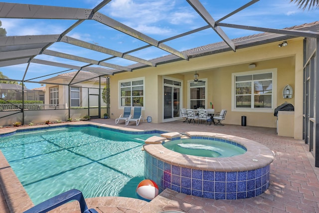 view of pool featuring a lanai, an in ground hot tub, and a patio