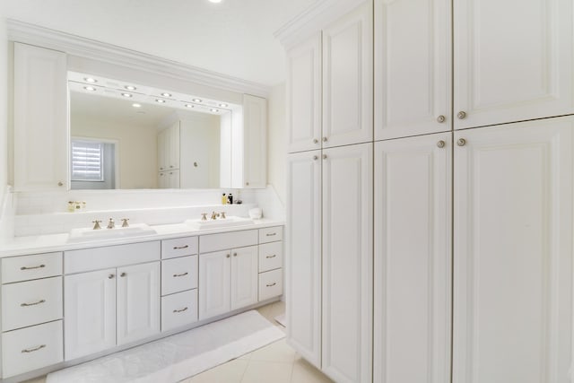 bathroom featuring tile patterned flooring and vanity