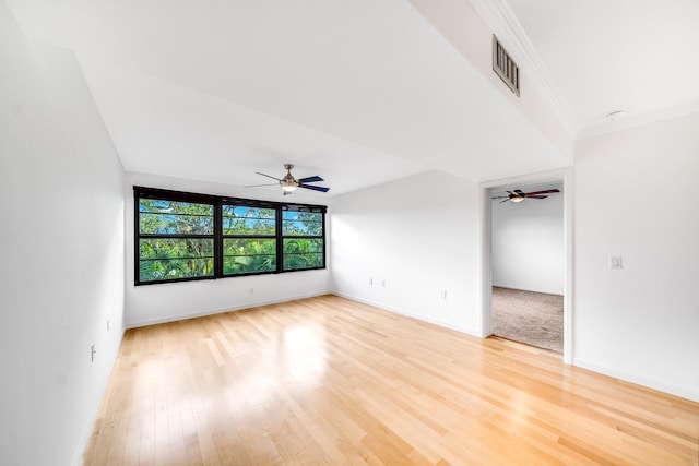 interior space featuring hardwood / wood-style floors and ornamental molding