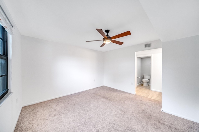 carpeted empty room with ceiling fan