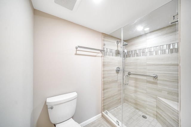 bathroom with toilet and an enclosed shower