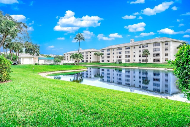 exterior space featuring a yard and a water view