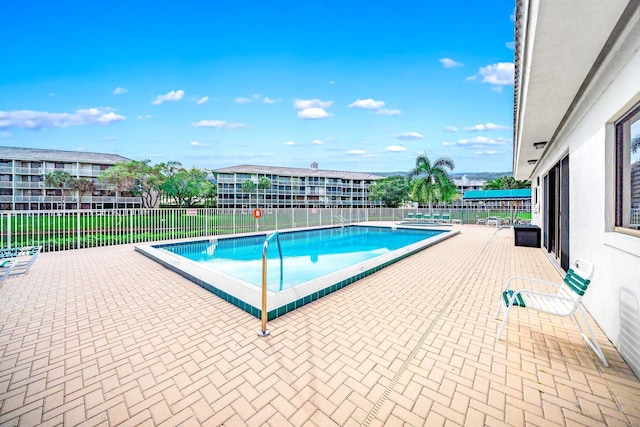 view of pool featuring a patio