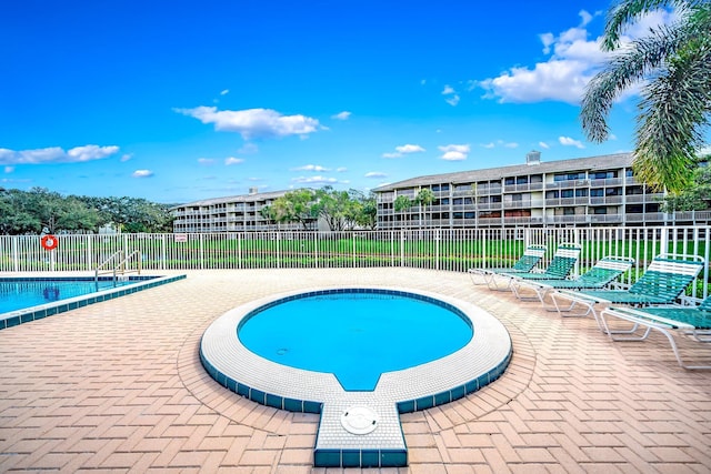 view of swimming pool featuring a patio