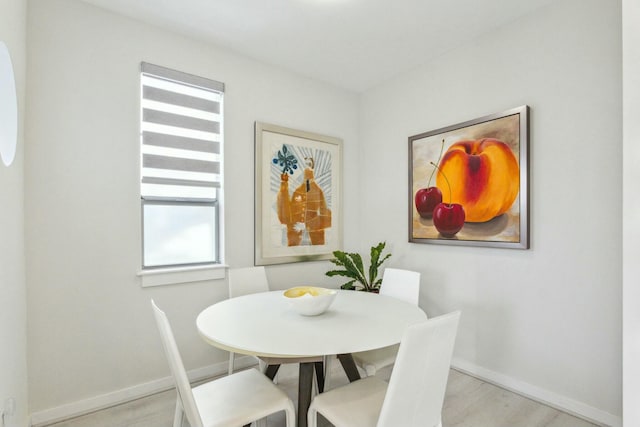 dining space featuring light wood-type flooring