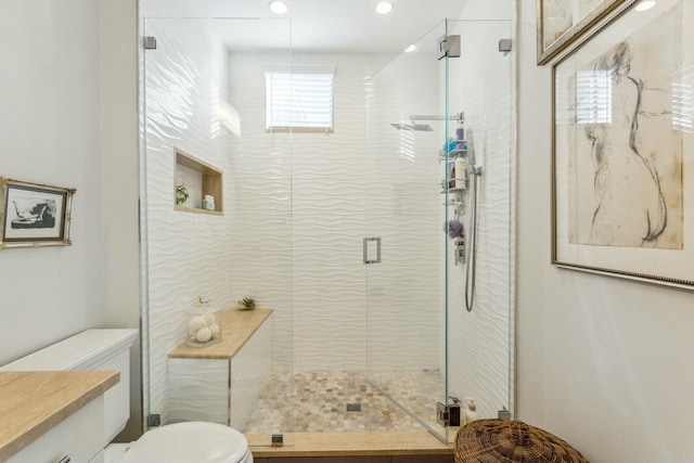 bathroom with toilet and walk in shower