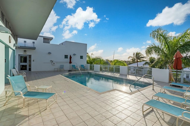 view of swimming pool with a patio area