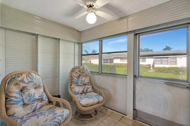 sunroom featuring ceiling fan and lofted ceiling