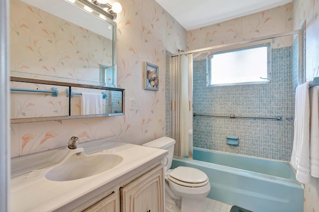 full bathroom with tile patterned flooring, vanity, toilet, and tiled shower / bath